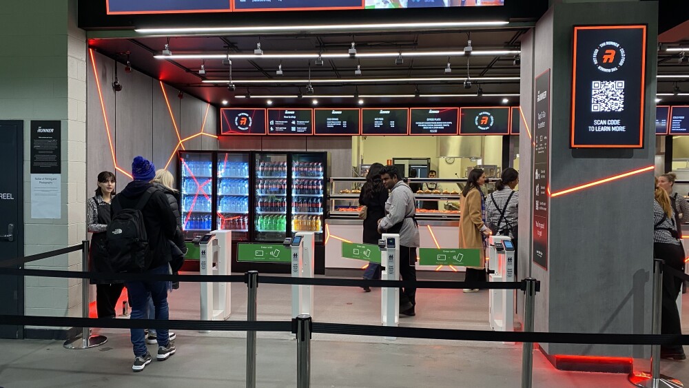 image of customers entering store through Just Walk Out technology-enabled gates at The Runner concessions outlet at Marvel Stadium in Melbourne, Australia